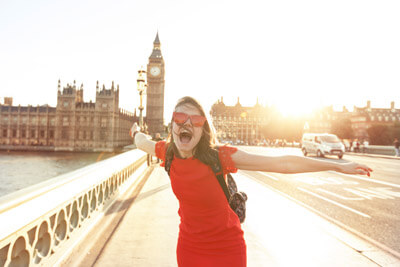 Woman having fun at sunset at Westminster bridge